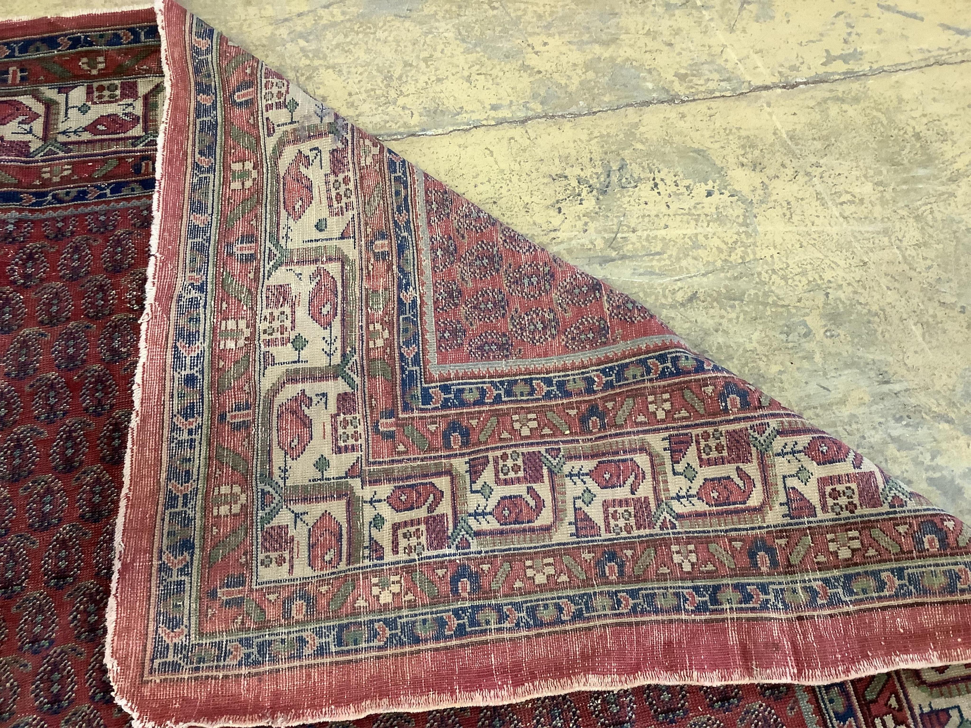 A Salouk red ground carpet, 350 x 265cm. Condition - poor to fair